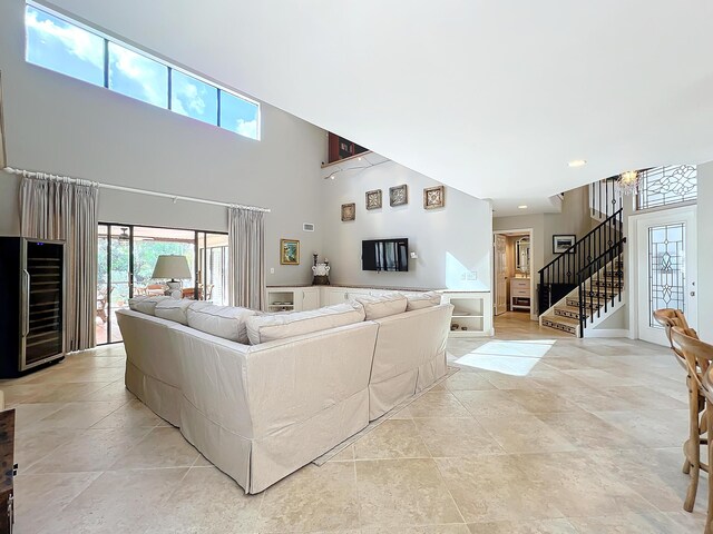 living room with a towering ceiling