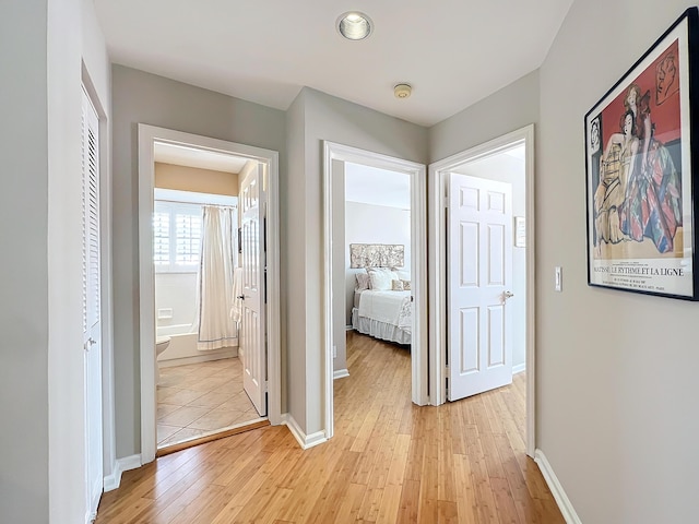 hallway featuring light wood-type flooring