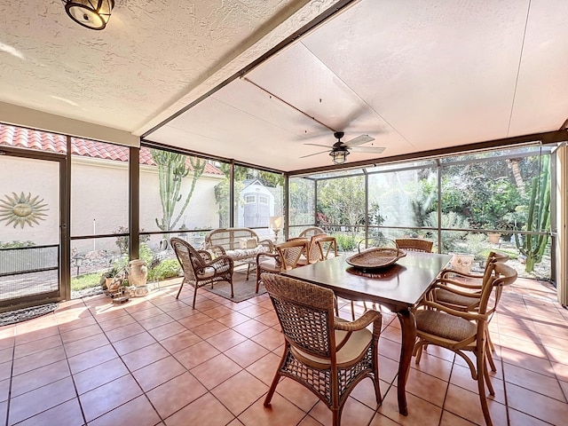 sunroom / solarium featuring ceiling fan and plenty of natural light