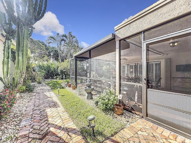 view of yard with a sunroom