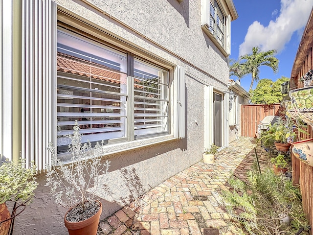 view of side of property with a patio