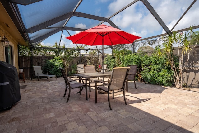 view of patio / terrace with a lanai and a grill