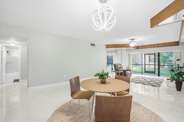 dining space with an inviting chandelier and a textured ceiling