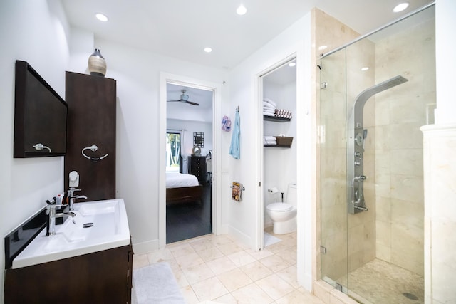 bathroom with toilet, a shower with shower door, ceiling fan, tile patterned flooring, and vanity