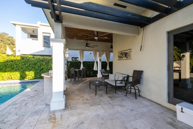 view of patio with a fenced in pool and ceiling fan