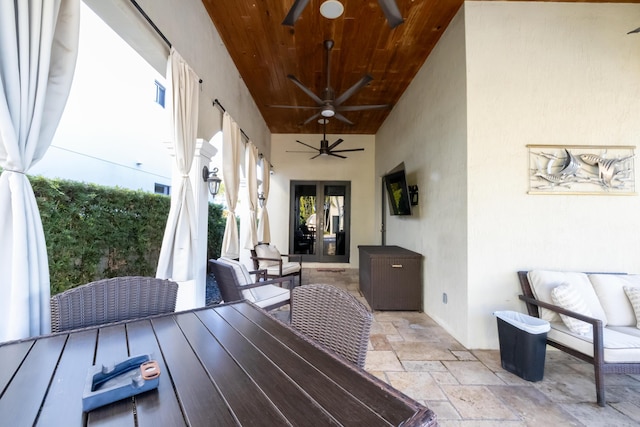 view of patio / terrace featuring ceiling fan and french doors