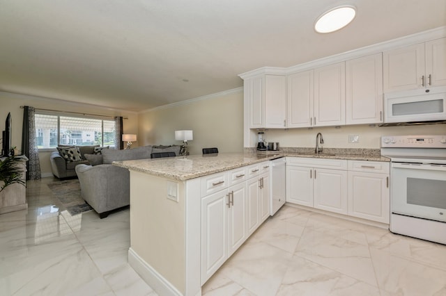 kitchen with kitchen peninsula, crown molding, white appliances, white cabinetry, and light stone countertops