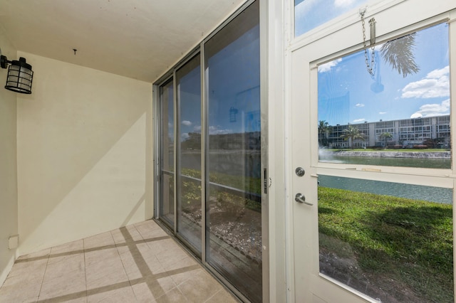 entryway with light tile patterned floors