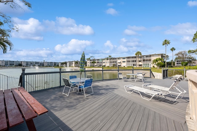 wooden terrace with a water view