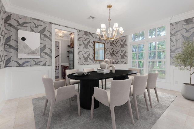 dining room featuring a wealth of natural light, ornamental molding, a notable chandelier, and light tile patterned flooring