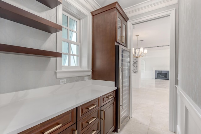 kitchen featuring light tile patterned flooring, hanging light fixtures, a chandelier, and wine cooler