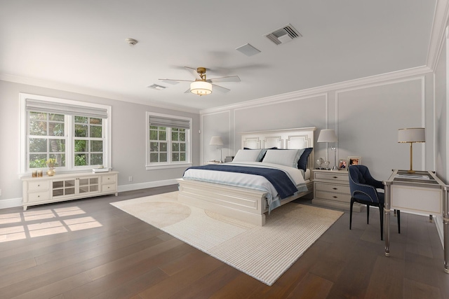 bedroom with ceiling fan, dark hardwood / wood-style flooring, and crown molding