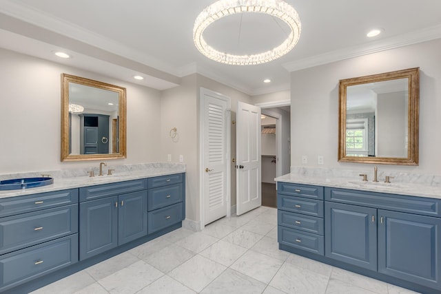 bathroom with ornamental molding and vanity