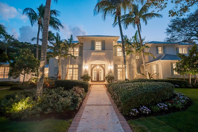 mediterranean / spanish home with french doors