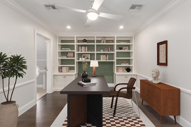 office with ceiling fan, built in shelves, dark hardwood / wood-style floors, and crown molding