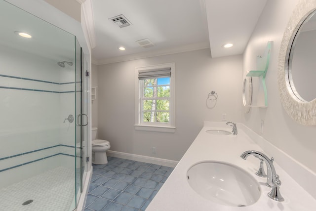 bathroom featuring toilet, vanity, a shower with door, and ornamental molding