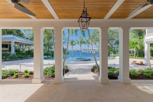 view of patio featuring ceiling fan