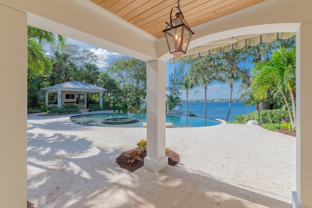 view of swimming pool with a water view, a gazebo, an in ground hot tub, and a patio