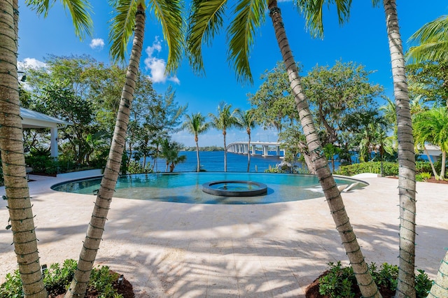 view of pool featuring a jacuzzi