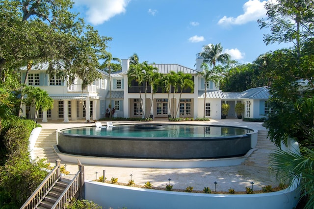 view of swimming pool with a patio area