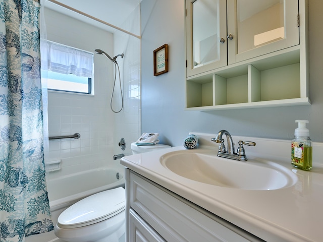 full bathroom featuring shower / bath combination with curtain, vanity, and toilet