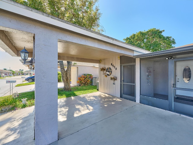 property entrance with a patio