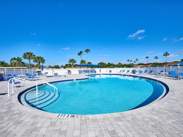 view of swimming pool with a patio