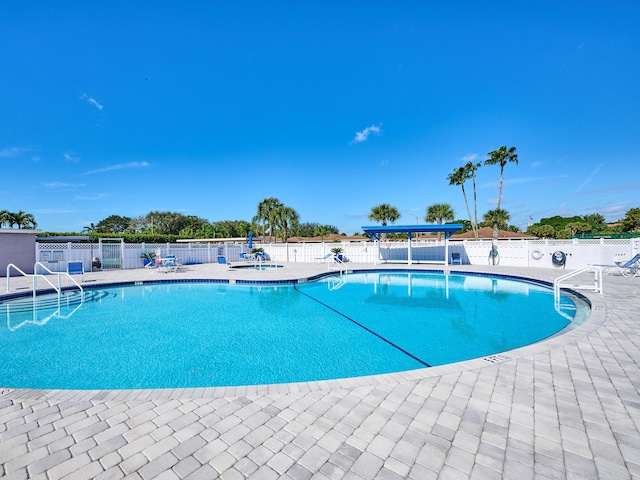 view of swimming pool with a patio area