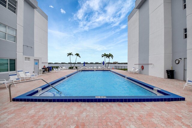 view of swimming pool featuring a patio area