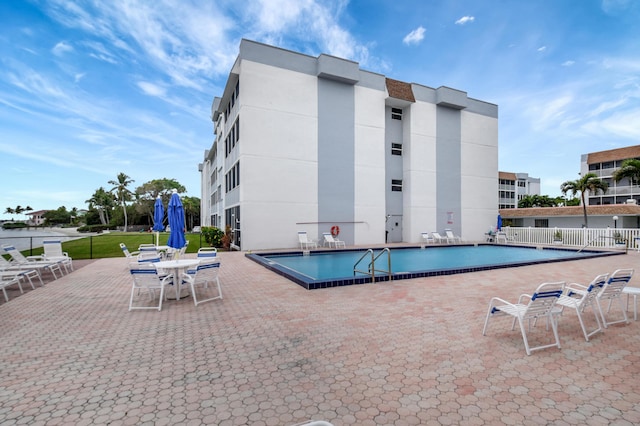 view of swimming pool with a patio