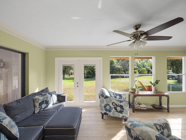 sunroom / solarium featuring french doors