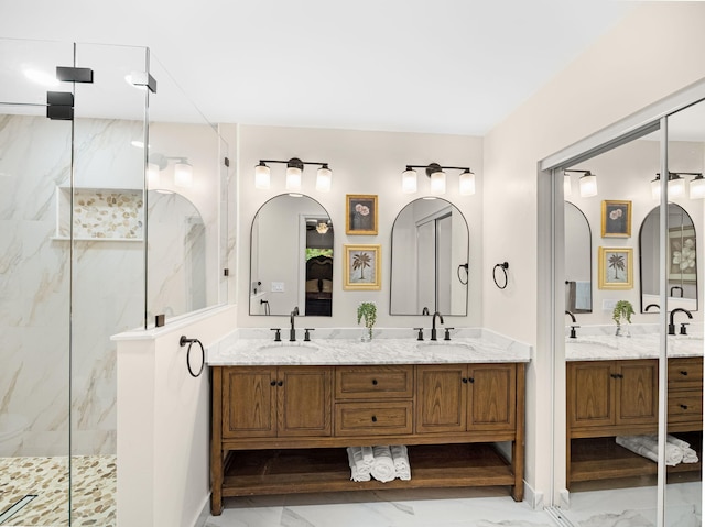 bathroom with vanity and tiled shower