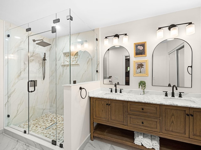 bathroom with vanity and a shower with door