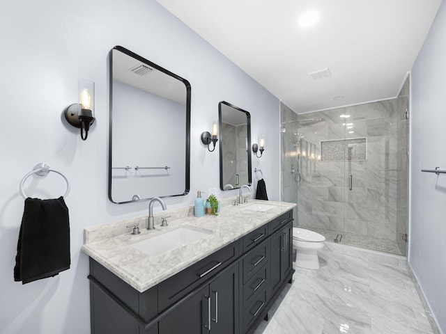 bathroom with vanity, an enclosed shower, and toilet