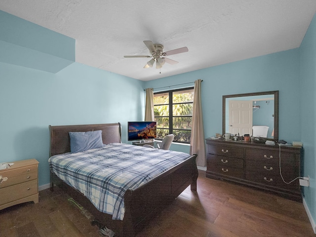 bedroom with dark wood-type flooring and ceiling fan