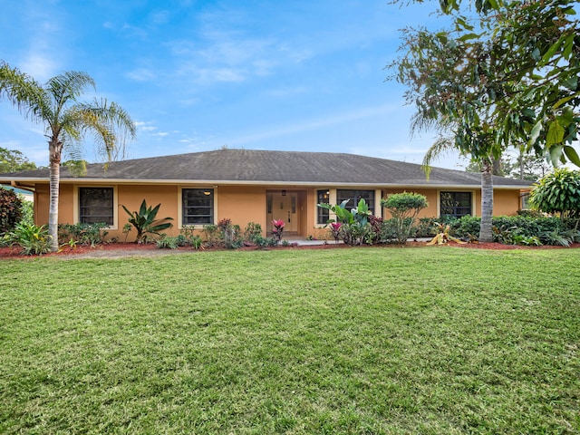 single story home featuring a front lawn