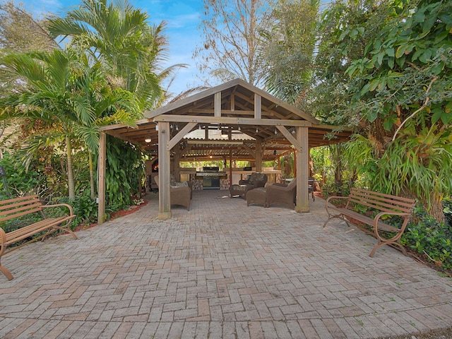 view of patio / terrace with an outdoor living space and a gazebo