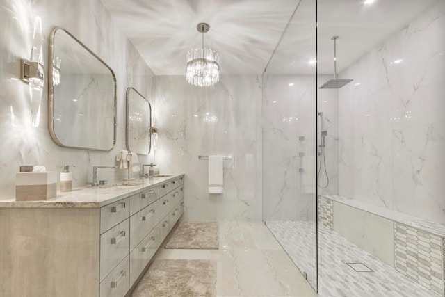 bathroom featuring vanity, a notable chandelier, and tiled shower