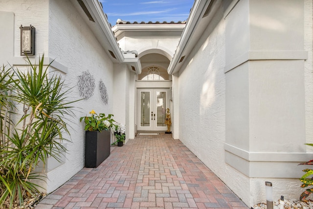 property entrance featuring french doors