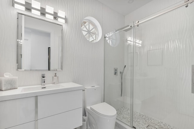 bathroom with toilet, a shower with shower door, tasteful backsplash, and vanity