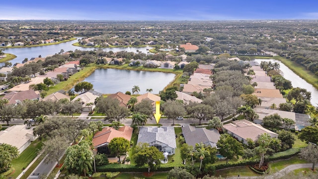 birds eye view of property with a water view