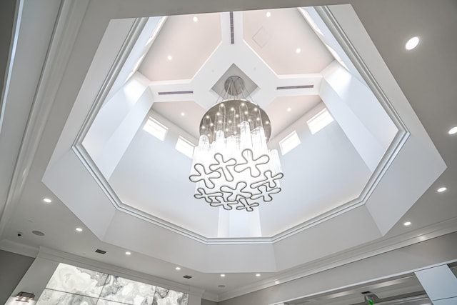 room details featuring an inviting chandelier and ornamental molding