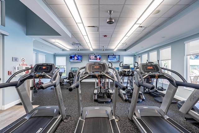 exercise room with a paneled ceiling