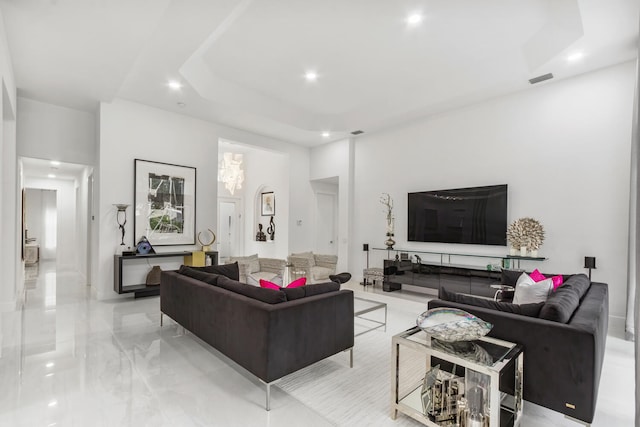 living room with a raised ceiling