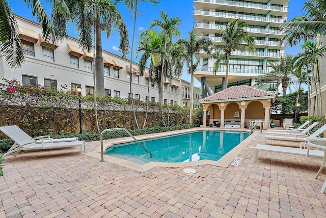 view of swimming pool with a patio