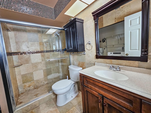 bathroom with toilet, vanity, and walk in shower