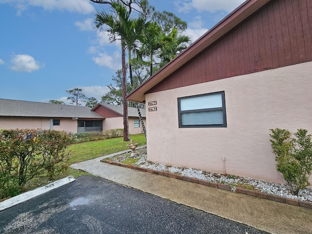 view of property exterior featuring a yard