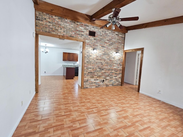 empty room featuring ceiling fan, brick wall, and beam ceiling