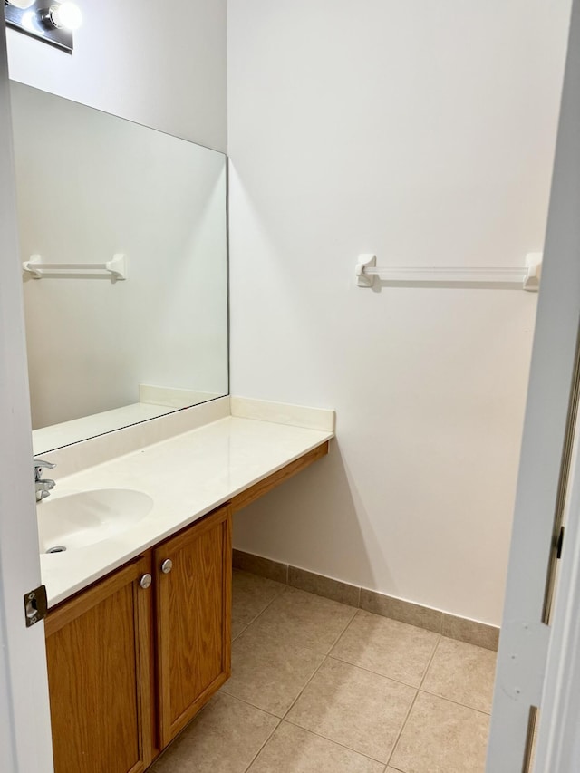 bathroom with tile patterned floors and vanity