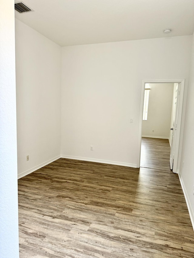 spare room featuring hardwood / wood-style flooring